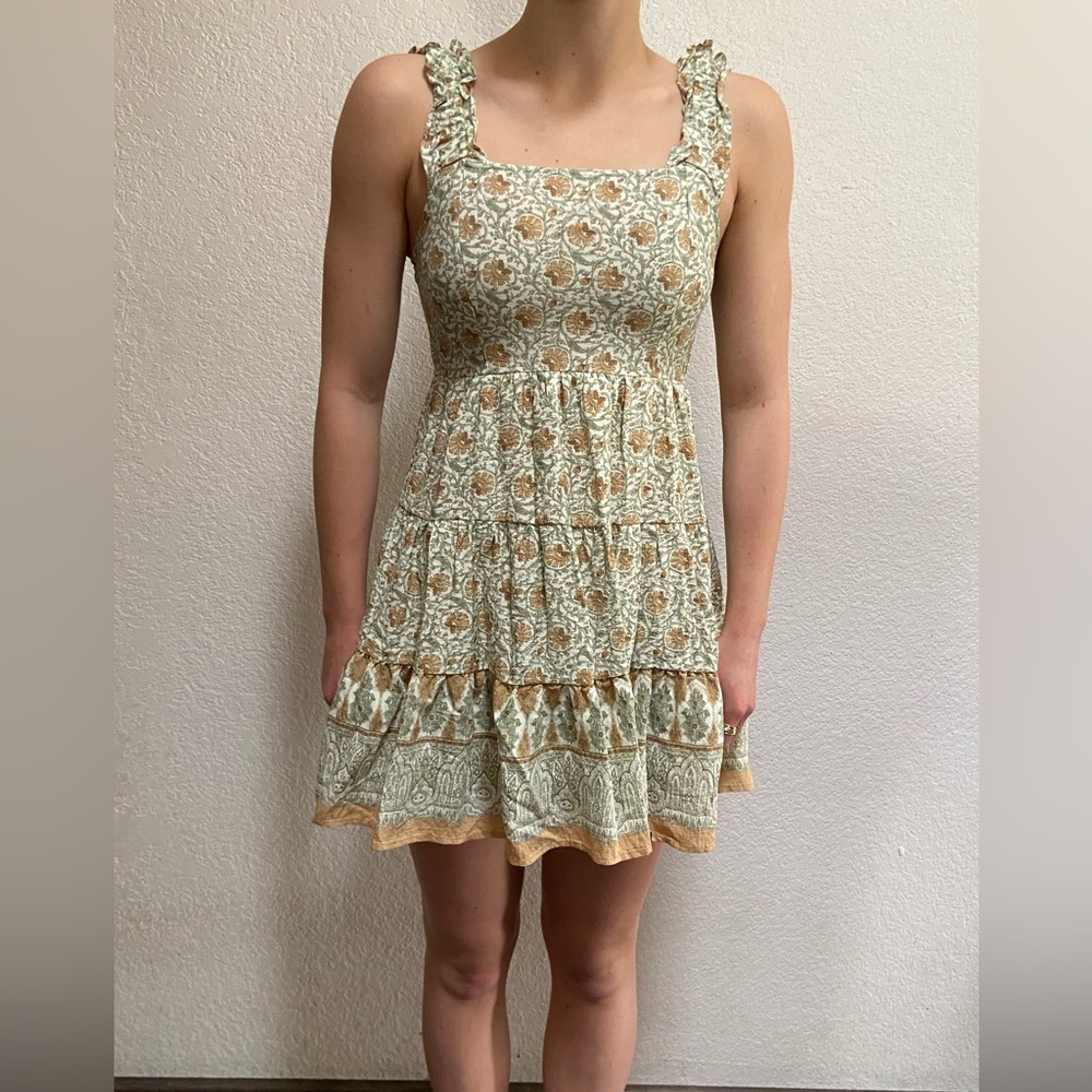 This is a blu pepper dress it is multi colored and has a vintage pattern